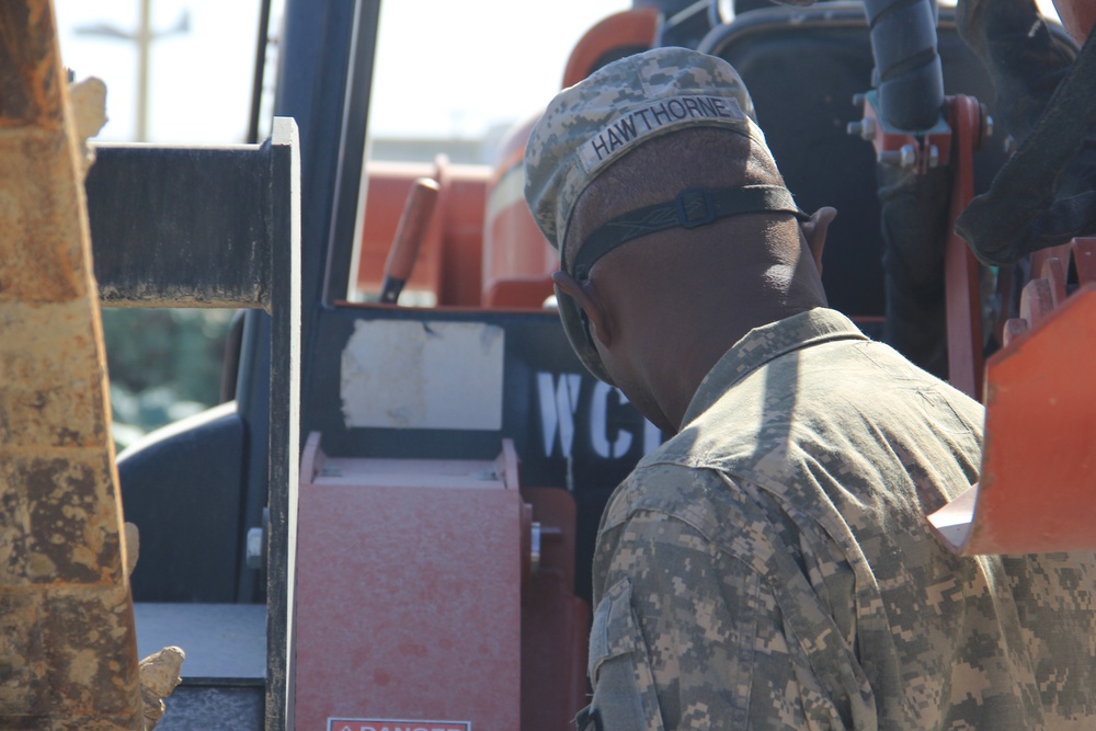 580th Signal soldier digs the ditch for signal operations