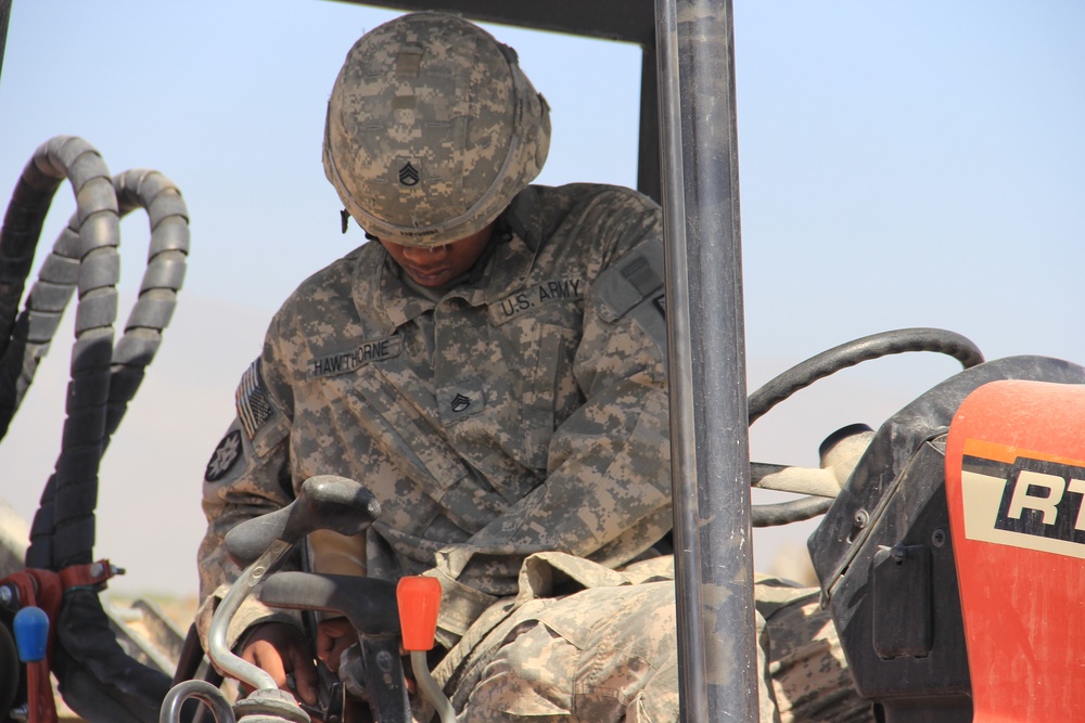 580th Signal soldier digs the ditch for signal operations