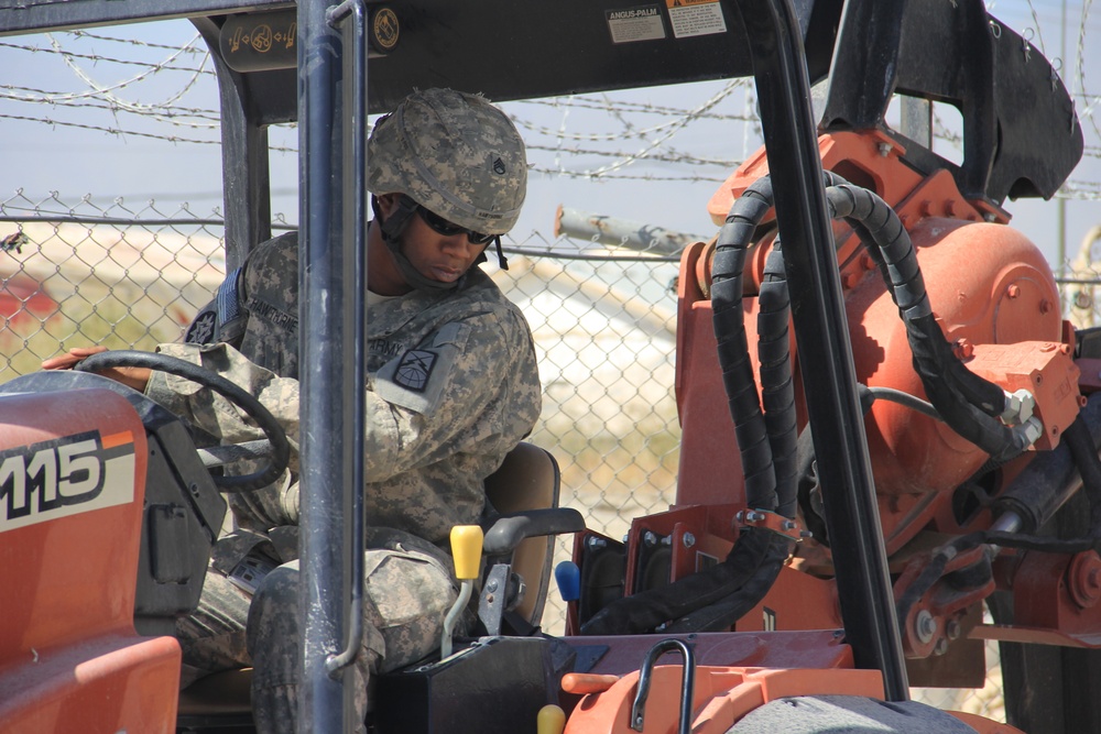 580th Signal soldier digs the ditch for signal operations