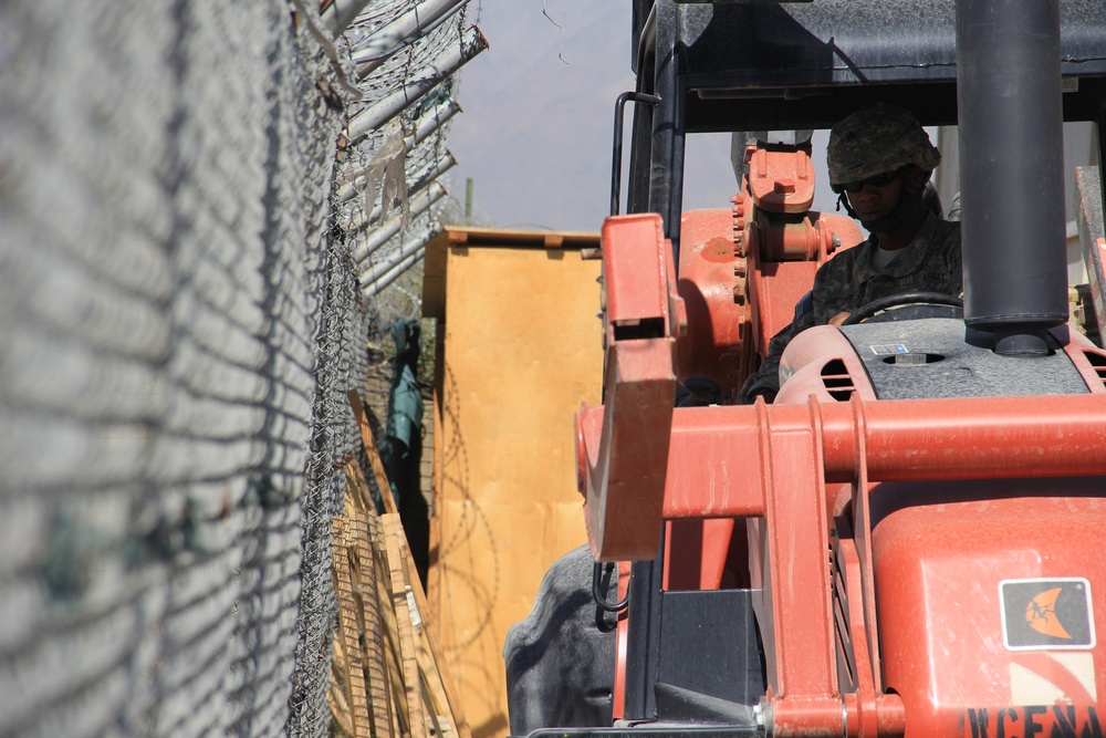 580th Signal soldier digs the ditch for signal operations