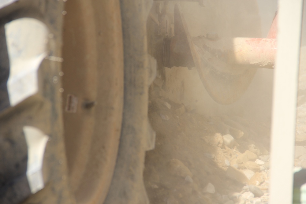 580th Signal soldier digs the ditch for signal operations