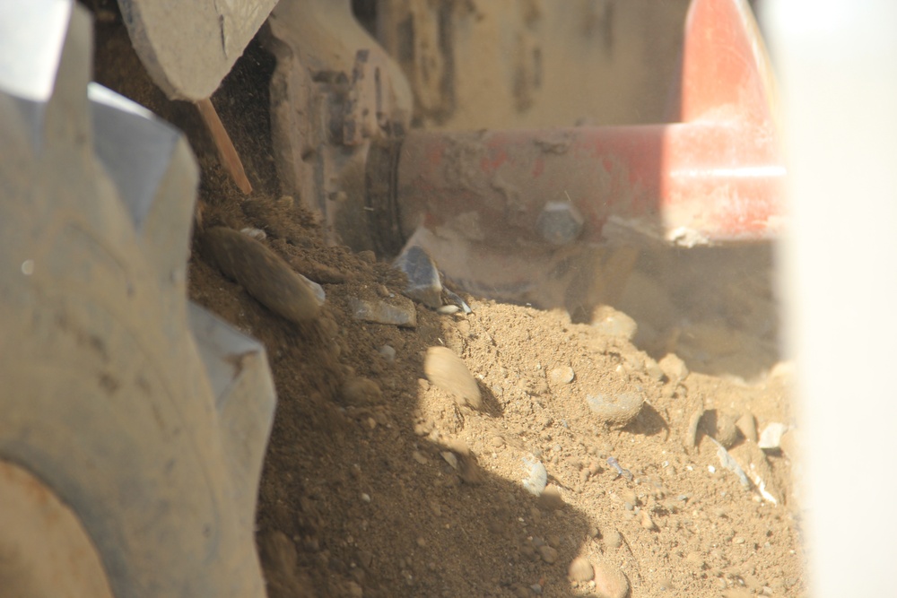 580th Signal soldier digs the ditch for signal operations