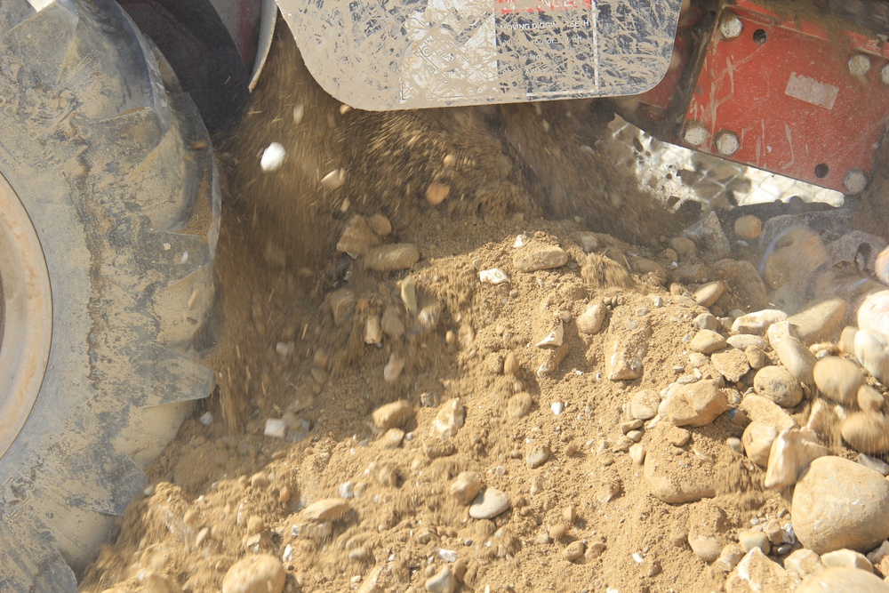 580th Signal soldier digs the ditch for signal operations