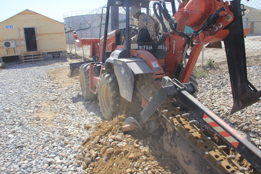 580th Signal soldier digs the ditch for signal operations