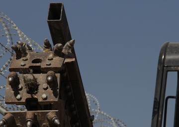 580th Signal soldier digs the ditch for signal operations