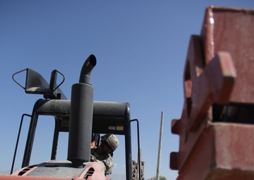 580th Signal soldier digs the ditch for signal operations