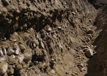 580th Signal soldier digs the ditch for signal operations