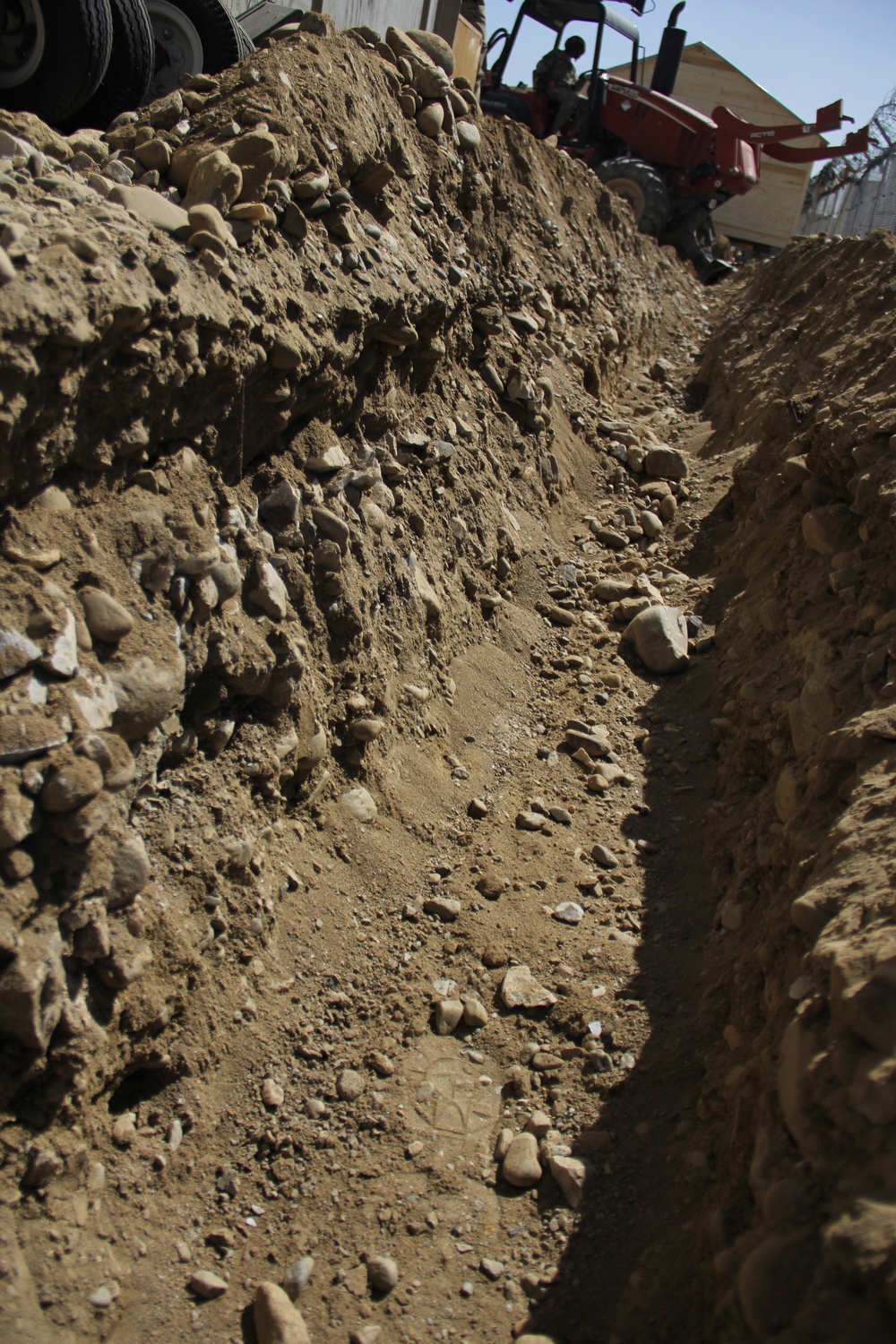 580th Signal soldier digs the ditch for signal operations