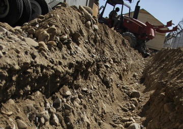 580th Signal soldier digs the ditch for signal operations