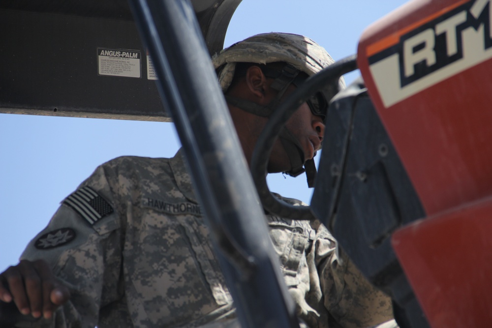 580th Signal soldier digs the ditch for signal operations