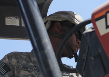 580th Signal soldier digs the ditch for signal operations