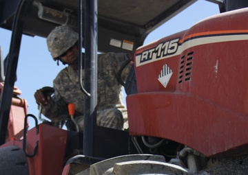 580th Signal soldier digs the ditch for signal operations