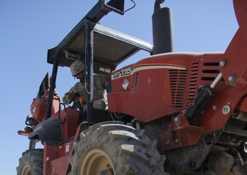 580th Signal soldier digs the ditch for signal operations