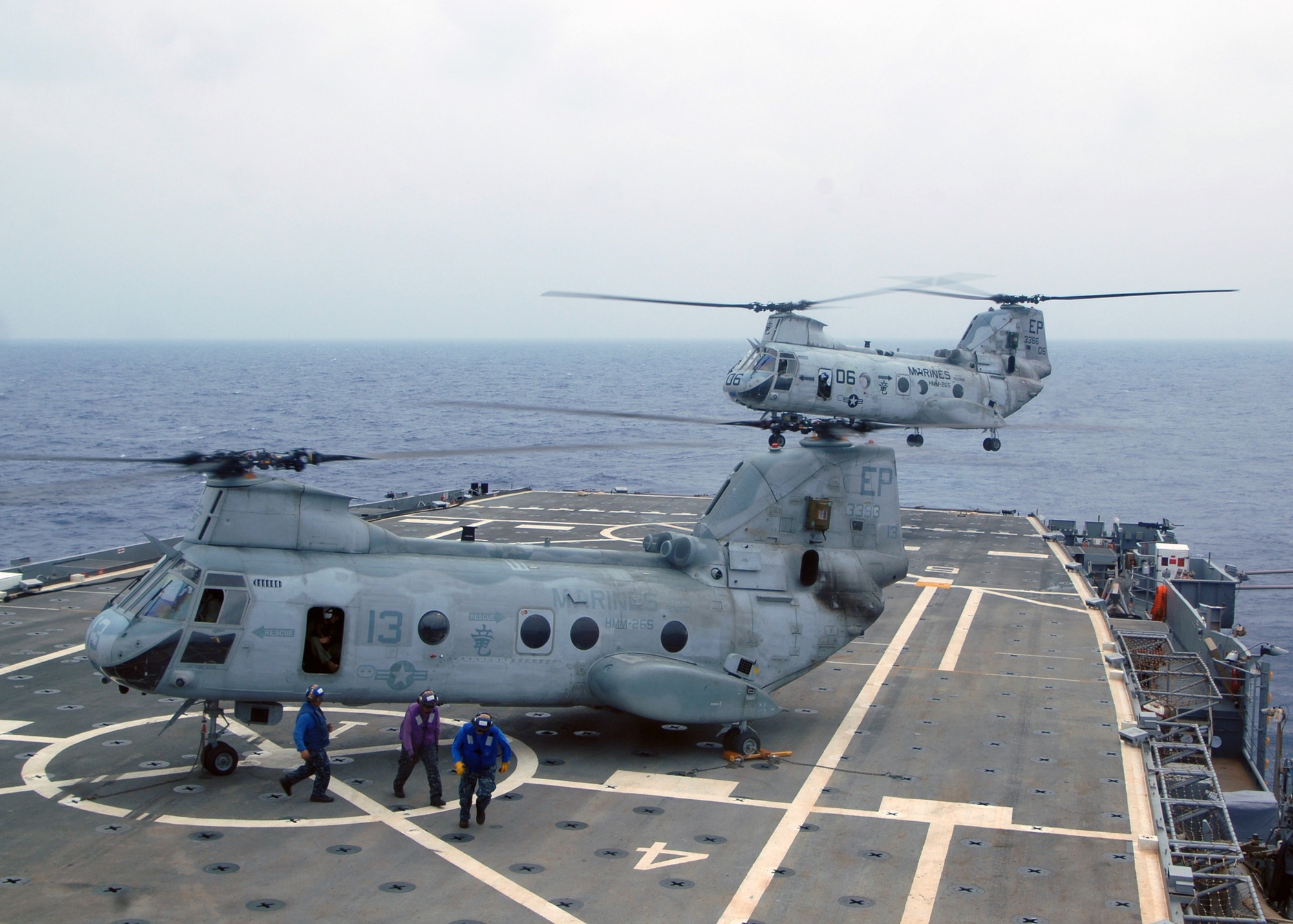 A USMC CH-46E (Sea Knight) helicopter from Marine Helicopter Squadron  Medium (HMM 262), come in for a landing on the flight deck of the USS Essex  (LHD 2). Marines from the 31st