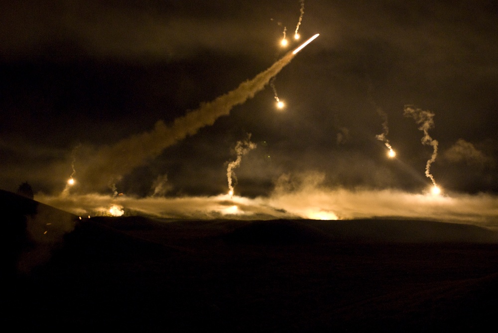 Flare streaks across the Department of the Army Best Warrior Night Fire