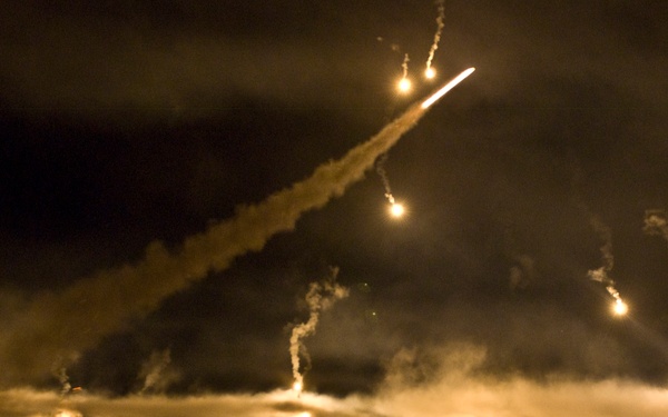 Flare streaks across the Department of the Army Best Warrior Night Fire