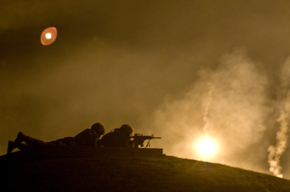 Warrior fires during Department of the Army best Warrior Night Fire