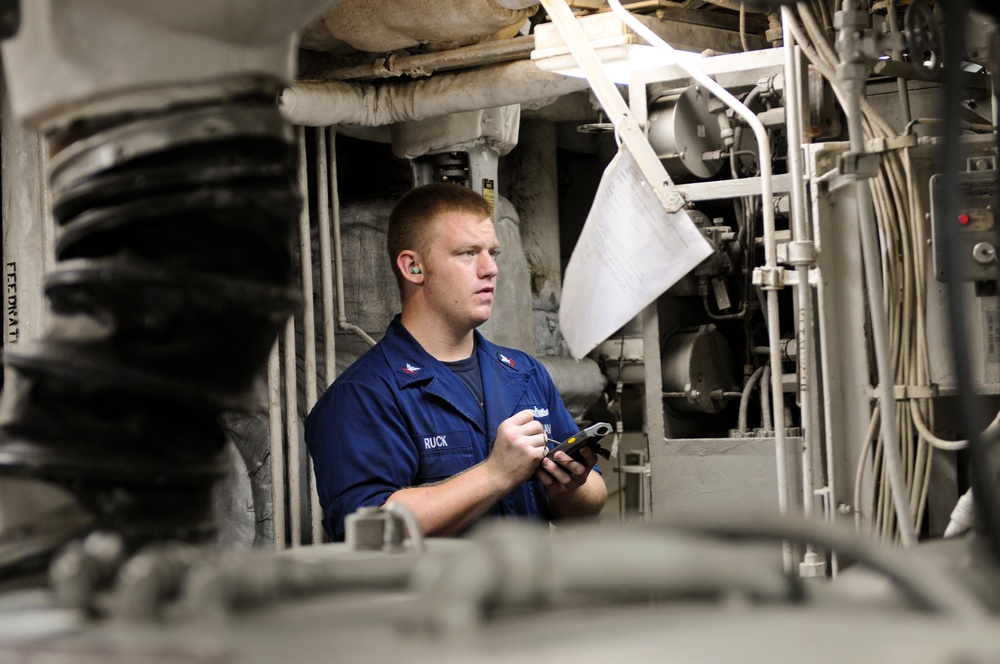 USS Anzio sailor monitors boiler readings