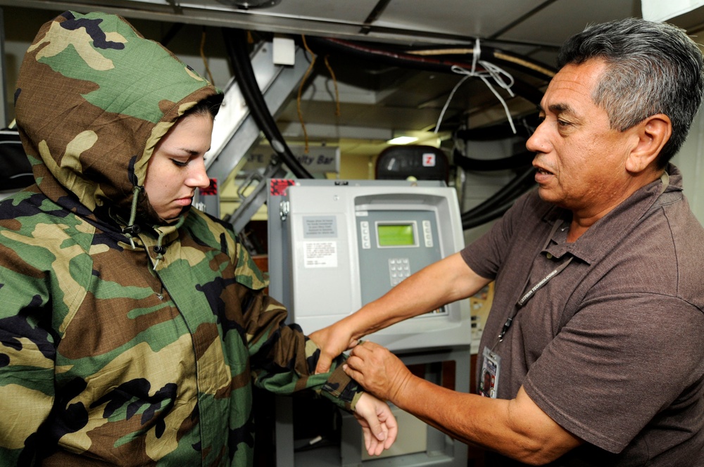 USS Blue Ridge sailor wears chemical gear