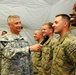 Sgt. Maj. of the Army presents coins to soldiers