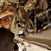 Airman cleans F/A-18E Super Hornet landing gear