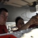 USS Ronald Reagan sailors perform check on missle launcher