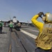 Sailor directs F-18F Super Hornet aboard USS Ronald Reagan