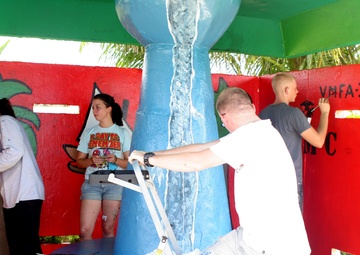 Service members help to give facelift to bus stops