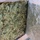 Operation Pipeline Express drug arrests The image shows a large compressed block of dried plant material consistent with cannabis/marijuana, wrapped in brown paper and foil packaging. The block appears to be a bulk quantity, tightly packed and compressed. This type of packaging is commonly associated with law enforcement seizure documentation.