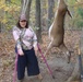 Young hunter with disability poses with her doe