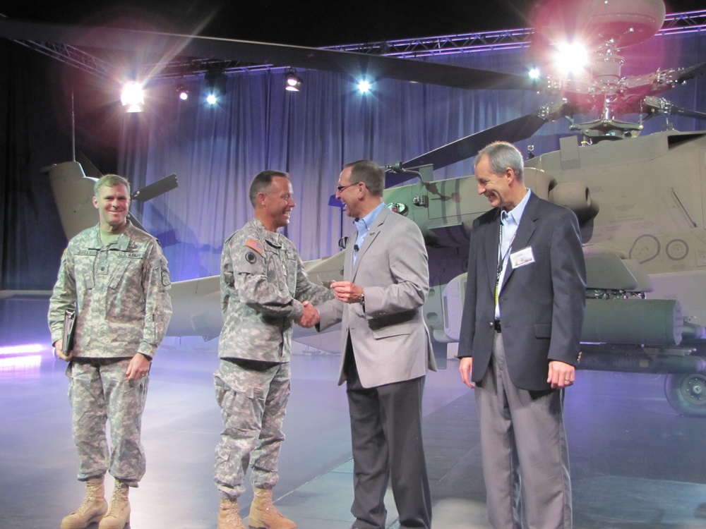 Army receives keys and log book of its first Apache Block III aircraft