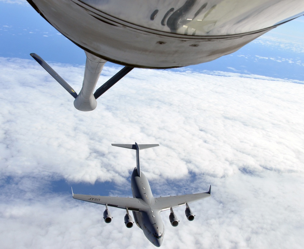 McConnell tanker refuels C-17 carrying wounded Libyan fighters to U.S.