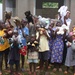 Service members deliver teddy bears to Ugandan children
