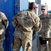 Command Sgt. Maj. Lambert presents coins to military working dog demonstrators