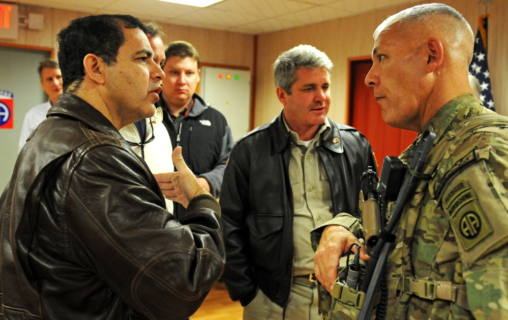 Regional Command (South) commander speaks with congressmen during their visit to the battle space