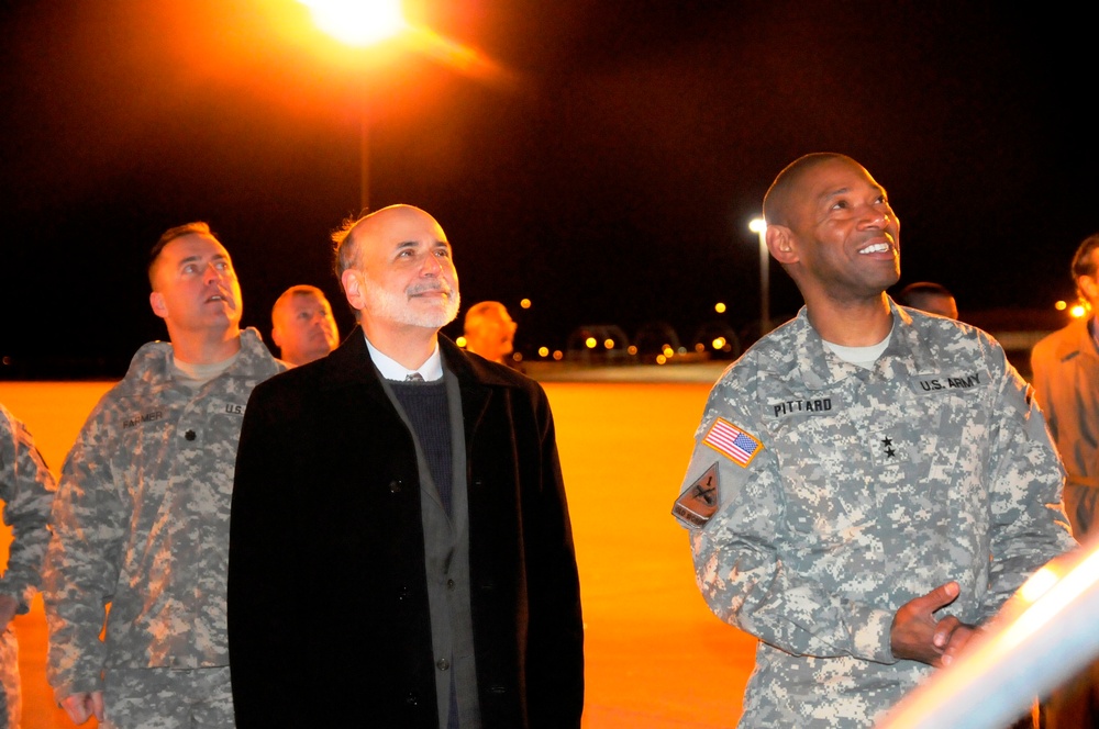 The chairman of the Federal Reserve greets troops as the return home from Iraq