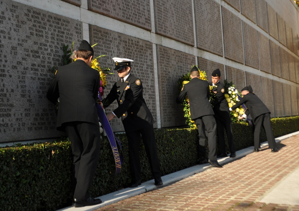 Navy JrROTC cadets lay wreathes at Florence American Cemetery