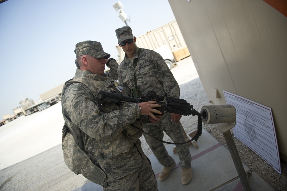 Staff Sgt. Joseph Worrell clears his rifle