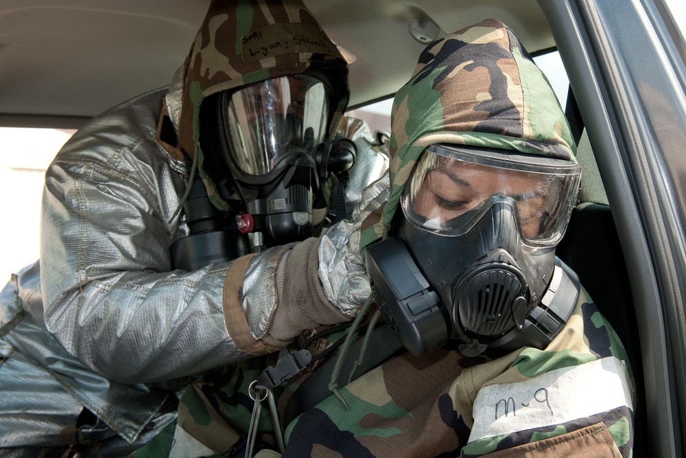 Yokota airmen perform a simulated casualty care in a contaminated environment