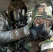 Yokota airmen perform a simulated casualty care in a contaminated environment