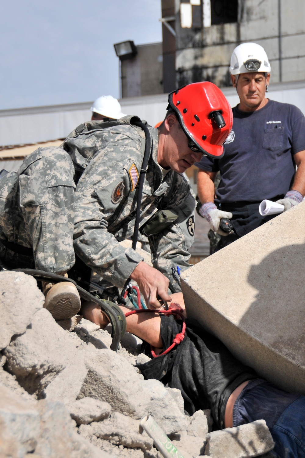 Combat engineers tunnel into leveled buildings to save lives