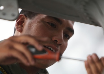 Maintenance on a AH-1Z Super Cobra aboard USS Makin Island