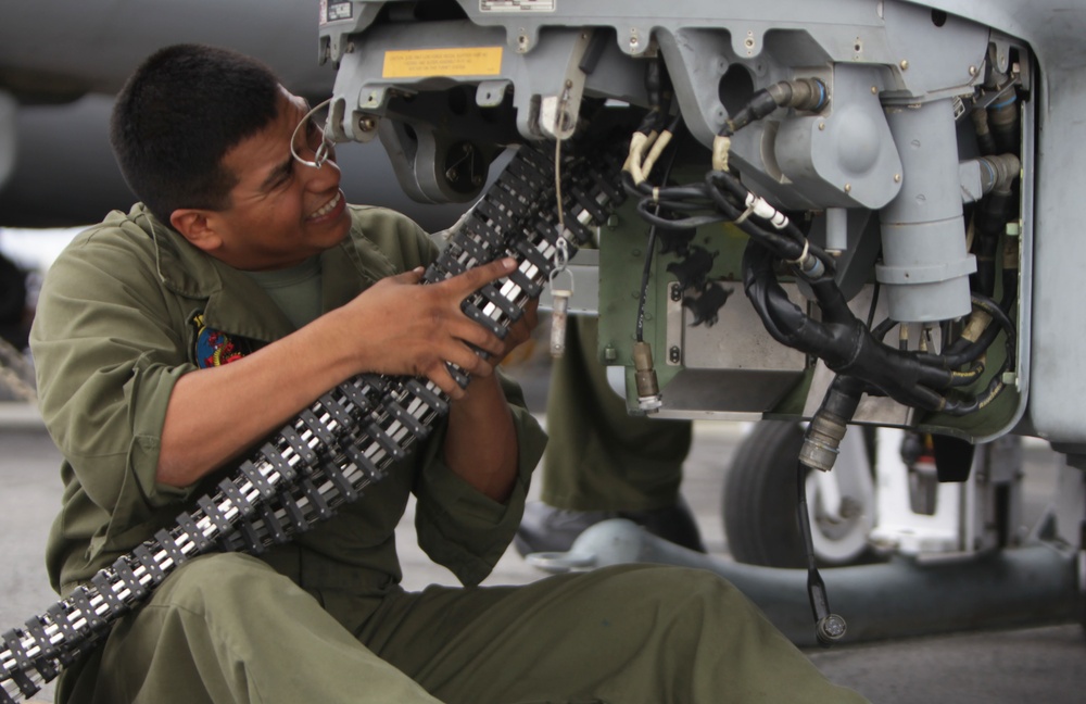 Maintenance on a AH-1Z Super Cobra aboard USS Makin Island