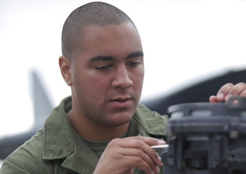 Maintenance on a AH-1Z Super Cobra aboard USS Makin Island