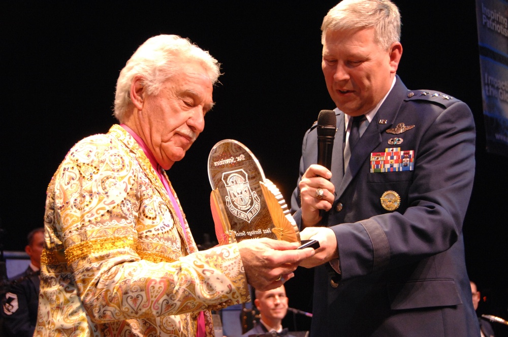 Air Force Lt. Gen. Christopher D. Miller presents award winning trumpeter and former Tonight Show band leader Doc Severinsen with a token of appreciation