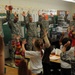 Students cheer with soldiers