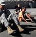 Soldiers do situps with students