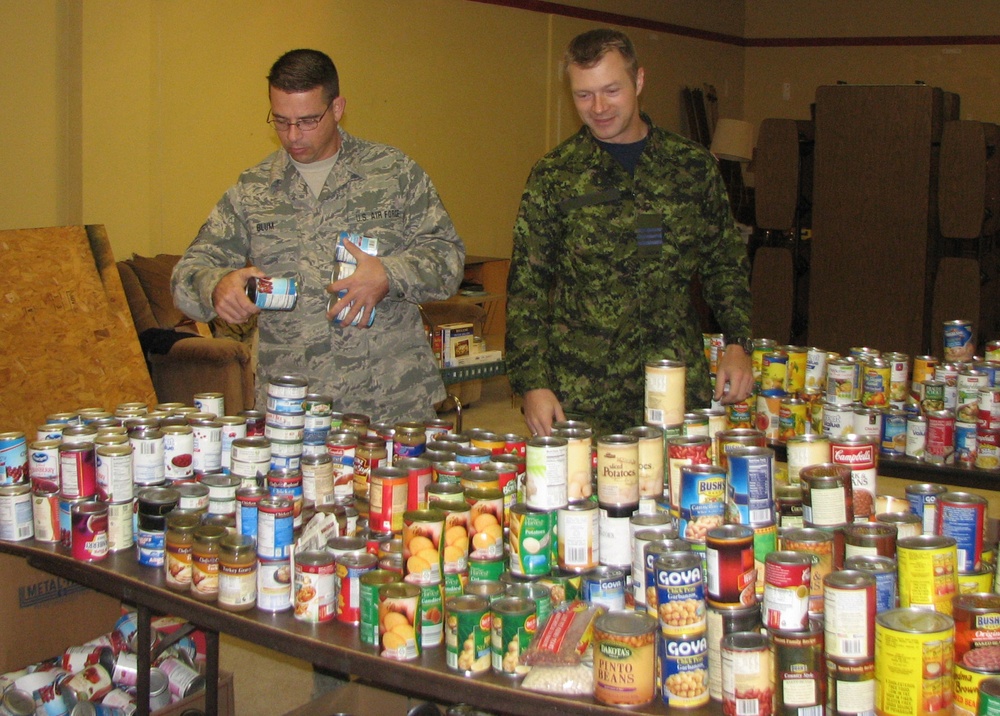 Eastern Air Defense Sector volunteers join Rome Rescue Mission to deliver Thanksgiving baskets