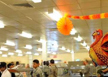 Service members enjoy a Thanksgiving feast, dining facility celebrates the holidays and its last day open
