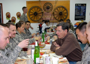 Soldiers share Thanksgiving meal with their soldier family